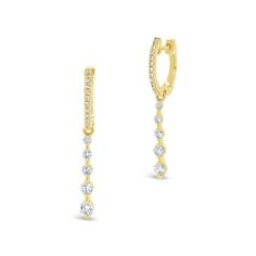 Designed to fit close to the ear, these stunning huggie earrings have a a nice pop of sparkle. What makes these buggies unique, is their bezel-set diamond drops. -14k gold weighing 2.03 grams -36 round diamonds weighing .46 carats Available in yellow, white, & rose gold. Please allow 4-6 weeks for delivery if item is not in stock. Style number E004061 Luxury Dangle Huggie Earrings With Prong Setting, Luxury Prong-set Huggie Earrings In Fine Jewelry Style, Classic Dangle Huggie Earrings With Diamond Accents, Individual Diamond Dangle Huggie Earrings, Fine Jewelry Dangle Huggie Earrings For Formal Events, Formal Fine Jewelry Huggie Dangle Earrings, Anniversary Dangle Huggie Earrings With Brilliant Cut, Diamond Dangle Huggie Earrings Fine Jewelry, Diamond Huggie Earrings With Prong Setting In Dangle Style