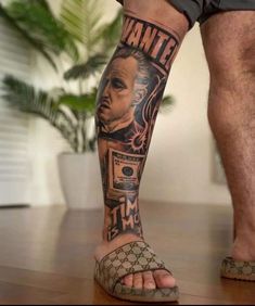 a man's legs with tattoos on them and his feet covered in an image