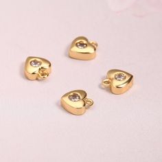 7x6mm 18k Shiny Gold Heart Charms,8Pcs Mini Heart Charm,Tiny Heart Pendant,CZ Heart Charm,3D Heart,Heart Necklace,Love Heart JewelryMaterial:18K Gold PlatedTheme:Heart/LoveShape: Heart CharmsSize :7x6mmHole size:1.5 mmColour :GoldenQuantity : 8PcsPendant weighs:12g/8pcsItem No.:AWW-P1304Note:Actual colors of any item or chains may slightly differ from screen to screen due to the screen resolution. We take our pictures in natural light during the day.If you have any questions or want a custom ord Heart-shaped Gold Plated Charms For Gifts, Rose Gold Heart Charms For Valentine's Day, Gold Heart Charm For Valentine's Day, Gold Heart Charms For Valentine's Day, Valentine's Day Heart Beads Charms With Heart Pendant, Valentine's Day Heart Charms Pendant, Valentine's Day Gold Heart Charm, Heart-shaped Charms For Valentine's Day Jewelry Making, Heart Charms For Jewelry Making Valentine's Day