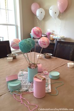 a table with balloons and other items on it