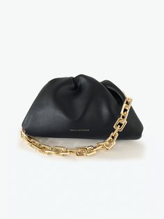 A classic day-to-night favorite from FREYA ESTEPHAN. Chain Pouch * Outer and inner lining made of 100% leather * Dimensions (Width, Depth, Height):    -Mini: 22 x 5.5 x 13 cm     -Medium: 31 x 7 x 18 cm   * Magnetic frame closure. Gold finish * Gold metal chain. Length 45cm. Removable NEW, with tags and box. Color: Black Elegant Soft Leather Black Pouch, Elegant Black Soft Leather Pouch, Black Smooth Grain Clutch Bag, Black Smooth Grain Clutch, Black Clutch With Smooth Grain, Black Smooth Grain Clutch For Travel, Magnetic Frame, Box Color, Leather Chain