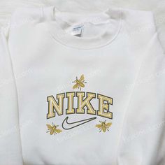 Introducing the Yellow Butterfly x Swoosh Nike Embroidered Shirt, a perfect blend of style and comfort. This unique collaboration showcases Nike Cartoon, Disney Character Shirts, Nike Inspired, Best Family Gifts, Embroidered Shirts, Custom Nike, Disney Sweatshirts, Hoodie Material, Custom Nikes