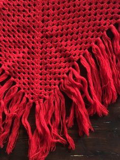 Light up the winter with this super vibrant red hand crochet fringe scarf! I love color in the winter and this red almost glows. Lovely hand crochet pattern with a triangular shape and long fringe. Use this in the winter and summer as well for when the temperature drops at night. Super fun to wear at a festival and channel your inner Stevie Nicks. The yarn is soft and not itchy to my skin. I think that it is a wool poly mix. No labels, made by a very talented knitter. Very good vintage condition Red Fringed Shawl For Fall, Red Fringe Shawl For Fall, Red Bohemian Shawl With Fringe, Red Bohemian Shawl For Winter, Red Handmade Bohemian Shawl, Kids Maxi, Boho Scarf, Crochet Fringe, Boho Scarfs