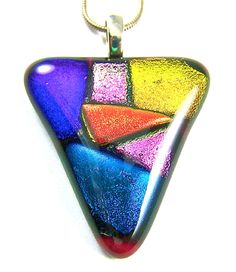 a multicolored glass pendant hangs from a chain