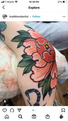 a woman's arm with flowers on it and a snake in the middle of her arm