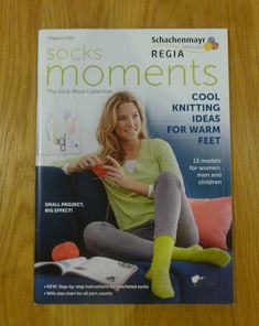 the cover of sock's moments magazine featuring a woman sitting on a couch with her feet up