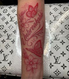 a woman's leg with a tattoo on it and the words underneath her arm