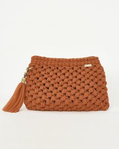 Exclusive wristlet handmade orange crochet bag, designed by high quality yarn in a classic line. With bronze zipper plus a tassel made by tulle yarn. With high quality loneta fabric and an additional inner pocket. A unique bag both simple and chic for a special person who wants to be different and feel beautiful. A really special gift for yourself for a friend or family you love, this bag will be your top every day accessory starting from a usual day out but also for special events such as weddi Orange Pouch Clutch For Daily Use, Orange Pouch Clutch For Everyday Use, Orange Clutch, Crochet Orange, Orange Crochet, Luxury Clutch, Wristlet Bag, Zippered Clutch, Bag Luxury