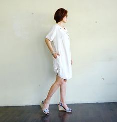 "A boho casual chic short sleeve cotton mix linen dress/tunic with curved hem. - Silhouette- - Loose fit body - Short sleeves - Pleated front dress - Curved hem - Hidden pockets in side seams of the dress - Body length - 94cm/37\" (longest part) Model is 161 cm. tall with the waist of 28\" and the hip of 38\" Status: ready to ship Weight: 302g Measurement: Tunic /dress (approximately) Shoulder: 16.25\" Bust: 42\" **can fit upto bust max38\" Armhole: 22\" Sleeve: 9\" Hip: 48\" **can fit upto bust Casual Short Sleeve Summer Dress With Relaxed Fit, Casual Short Sleeve Dress With Relaxed Fit For Summer, Casual Short Sleeve Beach Dress For Spring, Casual Cotton Short Sleeve Dress For Spring, Casual Short Sleeve Summer Dress For Day Out, Casual Cotton Short Sleeve Dress With Relaxed Fit, Short Sleeve Relaxed Fit Tunic For Vacation, Casual Cotton Knee-length Short Sleeve Dress, Vacation Tunic With Relaxed Fit And Short Sleeves