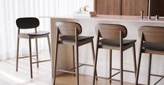 Pull up to the bar. Class up your counter space, island or bar area with this modern stool crafted from solid American white oak or black walnut. The comfortable foam padding is covered in sleek black leather for a clean, minimalist look. Solid American white oak or black walnut legs and frame High resiliency foam seat, with 100% top grain leather upholstery Arrives fully assembled Overall Dimensions: 17.5"W x 21.5"D x 34.45"H Seat Dimensions: 17.5"W x 16.25"D x 26"H Backrest Height: 10.5" Footr Space Island, Kitchen 2025, Leather Kitchen, Poly & Bark, Large Tables, Leather Counter Stools, Kitchen Counter Stools, Parcel Delivery, Modern Stools