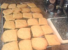 some biscuits are cooling on a rack in the kitchen