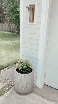 a planter sitting on the side of a house