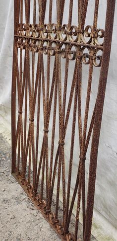 an old iron fence with rusted metal bars