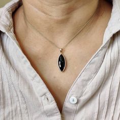 ITEM DESCRIPTION: >>The pendant is made from Solid 14K Yellow Gold. Gemstone used is absolutely natural and ethically sourced. >>Natural Black Onyx in bezel setting is studded on it with utmost precision. >>This is a minimalist design and is absolutely hassle-free and everyday jewelry. Gem: Black Onyx Gem size: 20x25 mm Gem weight: 8.39 carats Gold purity: 14K (58.33% approx.) Gold weight: 0.62 grams Gross weight: 2.29grams The Gold purity is guaranteed and it comes with authentic 14K gold hallm Bezel Pendant, December Birthstone, Everyday Jewelry, Black Onyx, Onyx, Solid Gold, Gems, Yellow Gold, Pendant Necklace