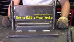 a man is working on a machine with the words how to build a press brake