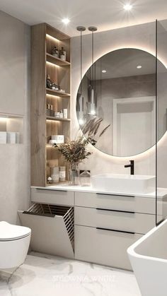 a bathroom with a large round mirror above the sink and white countertop, along with a toilet