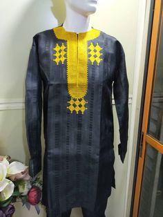 Kaftan for Men, African Native for Men , a 2 pieces Native Attire comprising of A Kaftan Top worn and a Sokoto which is the trouser pant to go with it. The Colour of this is Black with Gold embroidery. It's available for Immediate Shipping in Medium Size. You can however order this in any colours of your choice, just leave me a note when you Order. Ideal for Traditional Weddings, Birthday, and all sort of Celebrations. We would make this item to order within 5-10 working days, and Ship immediate Traditional Black Agbada For Ceremonies, Yellow Traditional Kaftan For Ceremonies, Traditional Yellow Kaftan For Ceremonies, Traditional Fitted Agbada With Long Sleeves, Ceremonial Long Sleeve Agbada For Festivals, Embroidered Long Sleeve Agbada For Festivals, Festive Embroidered Long Sleeve Agbada, Ceremonial Kurta With Traditional Patterns And Long Sleeves, Traditional Festive Kurta With Motif