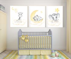 a baby's nursery room with two elephant pictures on the wall