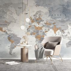 a chair and table in front of a wall with a world map on the wall