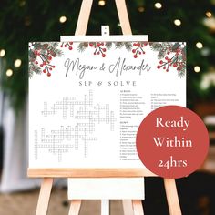 a wooden easel with a crossword puzzle on it and a christmas tree in the background