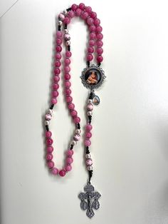 Welcome to my Shop "CREATING STILL MOMENTS."   To see all my listings and offerings, please visit my shop at  https://www.etsy.com/shop/CreatingStillMoments?ref=sh-carousel-1  Catholic gift mother, Handmade Rosary, Catholic gift, 10mm beads  Deep Pink Rosary, Quartz Rosary with Madonna cameo centerpiece, Catholic mom gift, RCIA gift, Confirmation gift  indulgence crucifix  colors are vibrant and gorgeous!  The silver crucifix and cameo centerpiece are beautifully detailed with yellow and black d Handmade Pink Rosary With Round Beads, Handmade Pink Rosary Bracelet With Round Beads, Pink Beaded Spiritual Rosary, Pink Rosary With Miraculous Medal As A Gift, Pink Rosary With 8mm Round Beads, Pink Rosary With 8mm Beads For Gift, Pink Rosary With 8mm Beads As Gift, Handmade Pink Spiritual Rosary, Pink 8mm Beads Rosary Bracelet