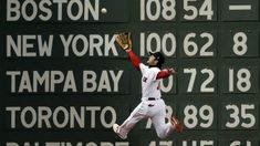 a baseball player is jumping in the air