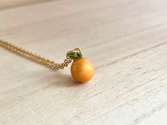 This dainty orange / tangerine necklace is made of the following: (1) Gold plated orange slice charm (charm size: 12 x 8.5mm) (2) Gold plated or 14KGF chain and findings ✏️ Please choose the length of the chain (the length includes clasp and findings) ✏️ Please choose your desired plating of chain ❣️ If you are unsure about which length to choose , please leave me a note to request an extension chain to be added to the chain at check out. 🍊EARRINGS 🍊 Threader -> https://www.etsy.com/listing Orange Necklace With Adjustable Chain For Gift, Orange Necklace With Adjustable Chain As Gift, Orange Pendant Charm Necklaces For Gifts, Orange Dainty Jewelry For Gifts, Dainty Orange Jewelry For Gifts, Dainty Orange Jewelry For Gift, Orange Round Necklace For Gifts, Adjustable Orange Necklace For Gifts, Handmade Orange Charm Necklace As A Gift