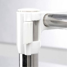 a close up view of the handle on a metal pole with a white plastic cover