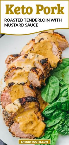 keto pork with mustard sauce and spinach leaves on a white plate, text reads keto pork roast roasted tender in with mustard sauce