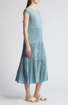 This crinkled hand-pleated midi is crafted from luxe silk with a flouncy tiered skirt. Back keyhole with button-and-loop closure Jewel neck Cap sleeves 100% silk Dry clean Imported Casual Midi-length Dress With Pleated Hem, Blue Pleated Knee-length Midi Dress, Blue Midi-length Pleated Dress, Eileen Fisher Crinkled Silk Dress, Midi-length Ruffled Viscose Dress, Jewel Neck, Silk Midi Dress, Eileen Fisher, Tier Skirt