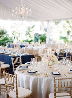 the tables are set with white and gold linens