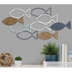 metal fish wall art hanging on the wall