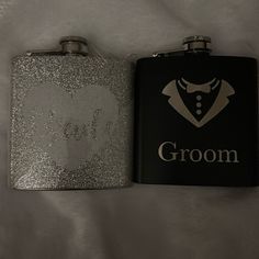 two flasks are sitting next to each other on a white sheet with the word groom printed on it