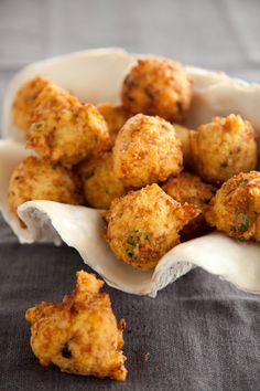 some fried food in a white bowl on a table