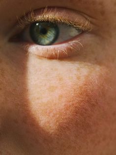 an image of a man's eyes with the sun shining on them