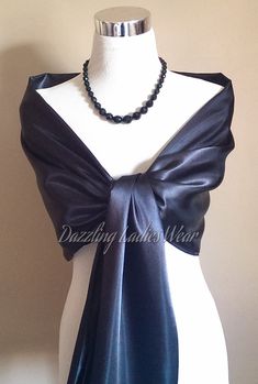 "All of our items are handmade and unique to our company.  Beautiful satin shawls, available in ivory, black, white and light silver/grey. Perfect to drape or wrap around your arms and shoulders.  Fantastic for weddings and formal occasions! Approximate measurements 78\" Long  27\" Wide Lots of other styles/colours available, click on link below to view my Etsy shop -  https://www.etsy.com/uk/shop/dazzlingladieswear?ref=hdr_shop_menu Composition - 100% polyester Due to different screen settings, colours can appear different on different screens, therefore the shade of the item in person, may vary slightly in person to the shade you see on screen." Shawl For Formal Dress, Satin Shawls, Halston Dress, Satin Shawl, Evening Shawls, Dress Form Mannequin, Bolero Shrug, Mother Of Groom Dresses, Gown Pattern