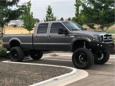 a large gray truck parked in a parking lot