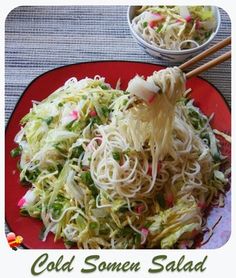 a red plate topped with noodles and veggies