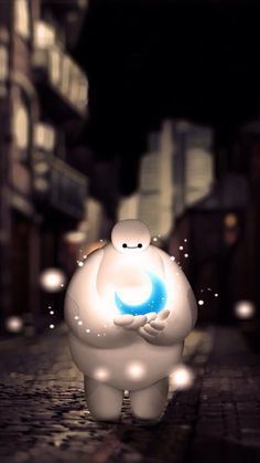 an animated character holding a blue ball in his hands on a city street at night