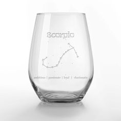 a wine glass with the zodiac sign sagitus engraved on it's side