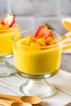 two small bowls filled with fruit on top of a table