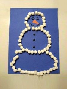 a snowman made out of marshmallows on a blue paper with the letter o