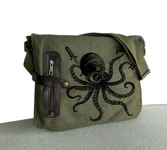 My latest " Ninja Octopus" Design on the Bag Each Bag was hand screen printed by me, so each bag is a little bet different. You might get slightly different from picture. * Dimensions:12"h x 15"w (middle) 12' (bottom) x 3.5"d  * 100% pigment-dyed, garment-washed cotton canvas * two large back exterior pockets (Kindle can fit in) * interior one big zippered pocket , 2 small pockets Octopus Design, Small Laptop, Messenger Bag Backpack, Fish In A Bag, Vintage Fishing, Hand Screen Printed, Messenger Bags, Khaki Green, New Bag