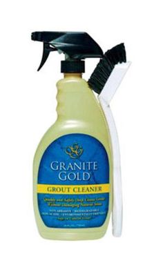 a bottle of granite gold cleaner with a brush on the top and an image of a white