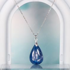 This elegant blue Kyanite teardrop pendant necklace is like a raindrop from heaven, the stone has a beautiful texture in blue green color. It's simple, yet elegant, and will be a great accent on your everyday outfit. Experience the beauty of nature with this stunning blue Kyanite pendant necklace! The unique teardrop design and vibrant blue-green color make it a truly eye-catching piece. Elevate any outfit with the simple yet elegant touch of this luxurious necklace. Each time you wear it, you'l Blue Teardrop Pendant Fine Necklace, Blue Teardrop Pendant Necklace With Natural Stones, Luxury Blue Teardrop Pendant Jewelry, Blue Teardrop Crystal Necklace For Gifts, Nickel-free Blue Teardrop Pendant Jewelry, Blue Kyanite, Rain Drops, Beautiful Textures, Jewelry Care