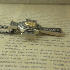 "Sterling Silver Wood Quay Celtic Cross Pendant with 18k Gold Beading 1\" long by 15/16\" wide 20\" Sterling Silver Oxidized Chain Hallmarked .925 Beautifully boxed with an explanation card Nicely boxed. Hallmarked and handcrafted in Ireland. In Stock! Ships Immediately. Wood Quay Inspiration: Over a thousand years ago, the Vikings pillaged and raided Irish Churches and Monasteries for their gold and silver. Accomplished craftsmen working in Temple Bar area of Dublin fashioned these precious met Traditional Jewelry With Chain As Gift, Luxury Cross Jewelry For Gifts, Luxury Cross Jewelry As Gift, Luxury Cross Jewelry Gift, Artisan Rectangular Gold Jewelry, Distinctive Cross Jewelry For Gifts, Luxury Handmade Custom Necklace For Gift, Rectangular Gold Artisan Jewelry, Unique Cross Jewelry For Gifts