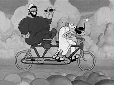 a man and woman riding on the back of a bike with an animal in it