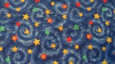 a blue background with multicolored stars on it