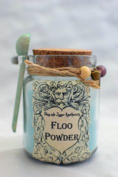 a glass jar with a spoon in it and label on the lid that says, flood waters