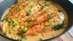 some food is cooking in a pan on the table and ready to be eaten or eaten